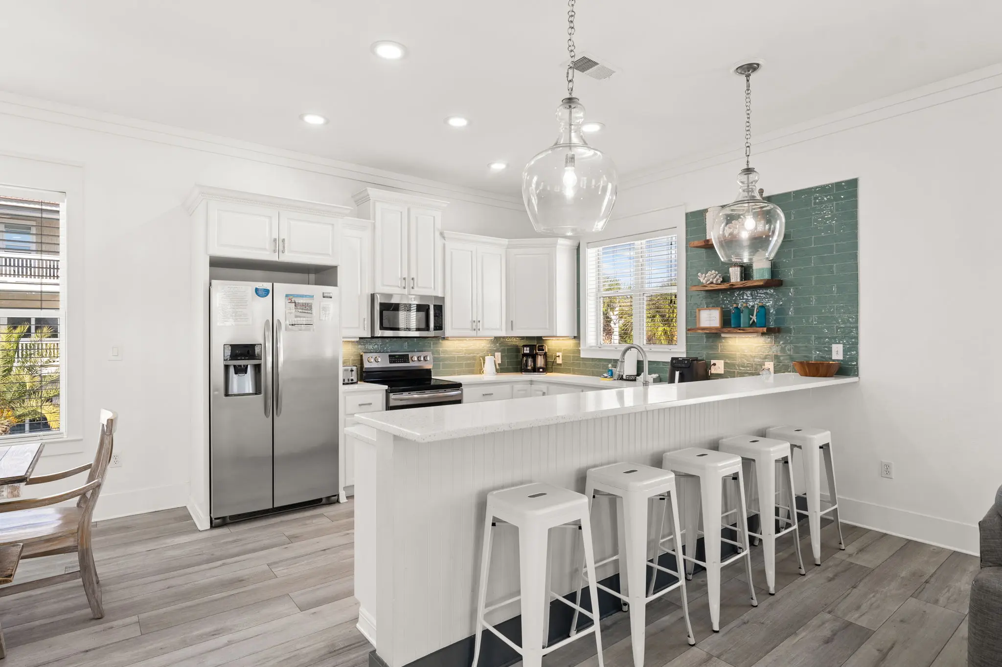 Kitchen island with bar seating and pendant lights